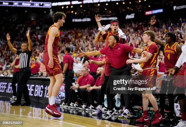 Milan Momcilovic of the Iowa State Cyclones celebrates with the bench after scoring during the second half of the Big 12 Men's Basketball Tournament...