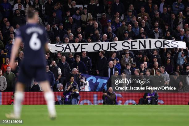 Tottenham fans hold up banners saying "Save Our Seniors" during the Premier League match between Fulham FC and Tottenham Hotspur at Craven Cottage on...