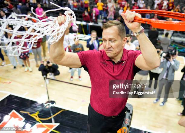 Head coach T. J. Otzelberger of the Iowa State Cyclones cuts down the net after defeating the Houston Cougars in the Big 12 Men's Basketball...