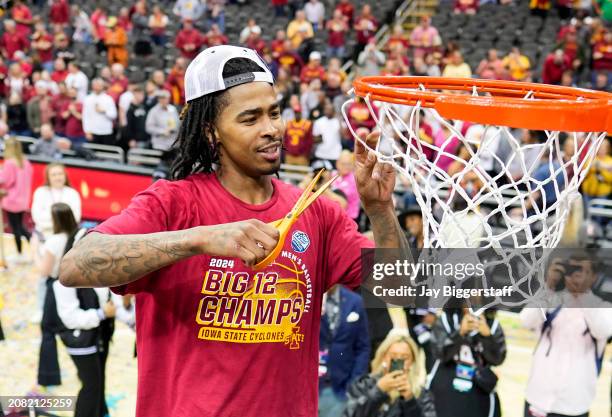 Keshon Gilbert of the Iowa State Cyclones cuts down the net after defeating the Houston Cougars in the Big 12 Men's Basketball Tournament...