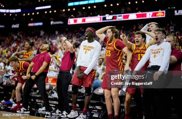 The Iowa State Cyclones bench celebrates during the second half of the Big 12 Men's Basketball Tournament championship game against the Houston...