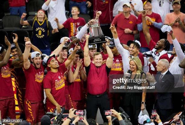 The Iowa State Cyclones celebrate after defeating the Houston Cougars in the Big 12 Men's Basketball Tournament championship game at T-Mobile Center...