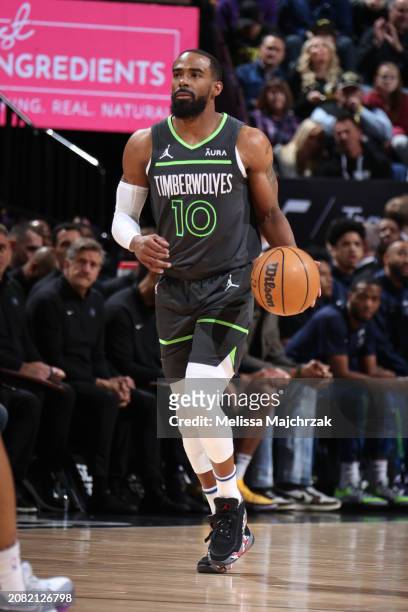 Mike Conley of the Minnesota Timberwolves dribbles the ball during the game against the Utah Jazz on March 16, 2024 at Delta Center in Salt Lake...