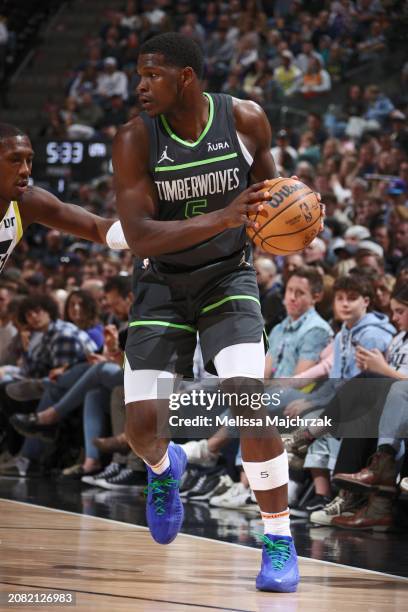 Anthony Edwards of the Minnesota Timberwolves looks to pass the ball during the game against the Utah Jazz on March 16, 2024 at Delta Center in Salt...