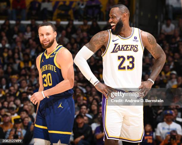 LeBron James of the Los Angeles Lakers & Stephen Curry of the Golden State Warriors looks on during the game on March 16, 2024 at Crypto.Com Arena in...