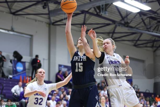 Sofia Rosa of the Smith Pioneers shoots against Caroline Peper and Natalie Bruns of the New York Violets in the second half during the Division III...