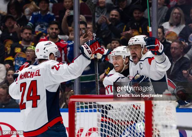 Washington Capitals center Connor McMichael , right wing T.J. Oshie and left wing Alex Ovechkin celebrate Ovechkin's goal during an NHL game between...