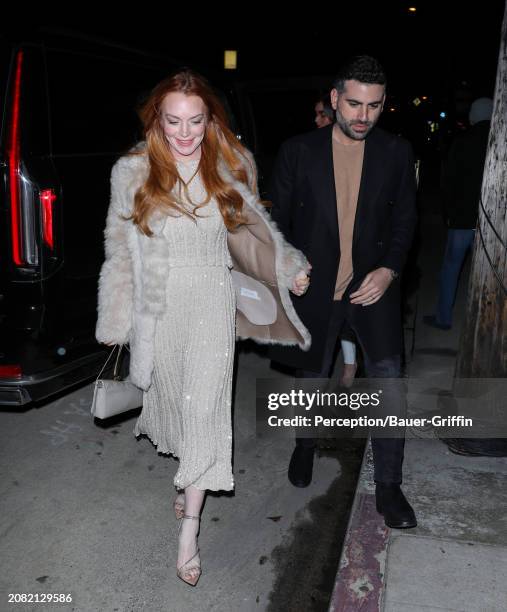 Lindsay Lohan and Bader Shammas are seen arriving to Giorgio Baldi on March 16, 2024 in Santa Monica, California.