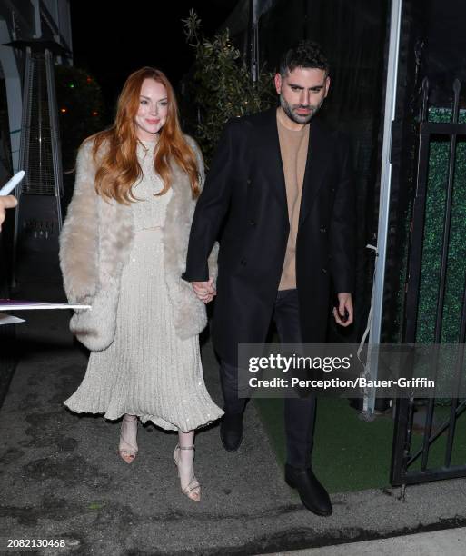 Lindsay Lohan and Bader Shammas are seen leaving Giorgio Baldi on March 16, 2024 in Santa Monica, California.