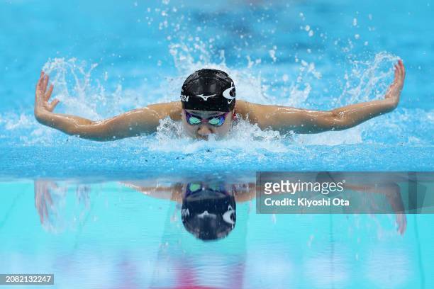 Miyu Aizawa of Japan competes in the Women's 100m Butterfly Heat during day one of the Swimming Olympic Qualifier at Tokyo Aquatics Centre on March...