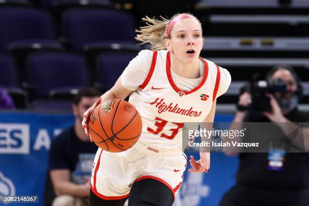 Ellie Taylor of the Radford Highlanders dribbles against the Presbyterian Blue Hose during the Big South Women's Basketball Championship at High...