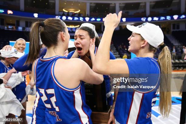 Bryanna Brady of the Presbyterian Blue Hose celebrates with the team after defeating the Radford Highlanders during the Big South Women's Basketball...