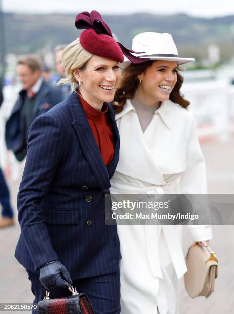 Zara Tindall and Princess Eugenie attend day 2 'Style Wednesday' of the Cheltenham Festival at Cheltenham Racecourse on March 13, 2024 in Cheltenham,...