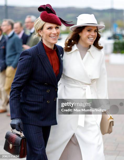 Zara Tindall and Princess Eugenie attend day 2 'Style Wednesday' of the Cheltenham Festival at Cheltenham Racecourse on March 13, 2024 in Cheltenham,...