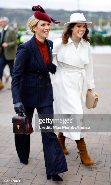 Zara Tindall and Princess Eugenie attend day 2 'Style Wednesday' of the Cheltenham Festival at Cheltenham Racecourse on March 13, 2024 in Cheltenham,...