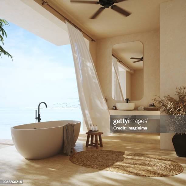 ruhiges badezimmer auf tropischer insel - modern beach house interior stock-fotos und bilder