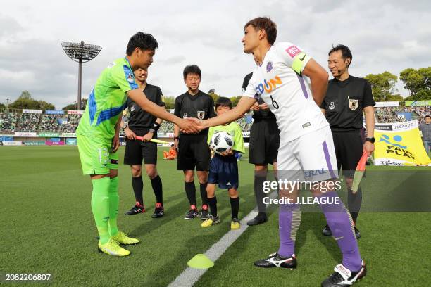 Captains Miki Yamane of Shonan Bellmare and Toshihiro Aoyama of Sanfrecce Hiroshima shake hands at the coin toss prior to the J.League J1 match...