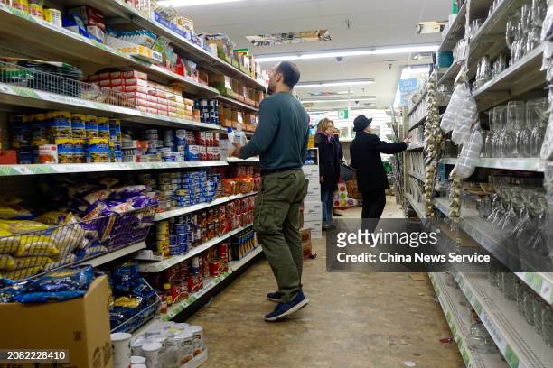 Consumers purchase products at a Dollar Tree store on March 13, 2024 in New York City. The budget variety store chain said it would close 1,000...