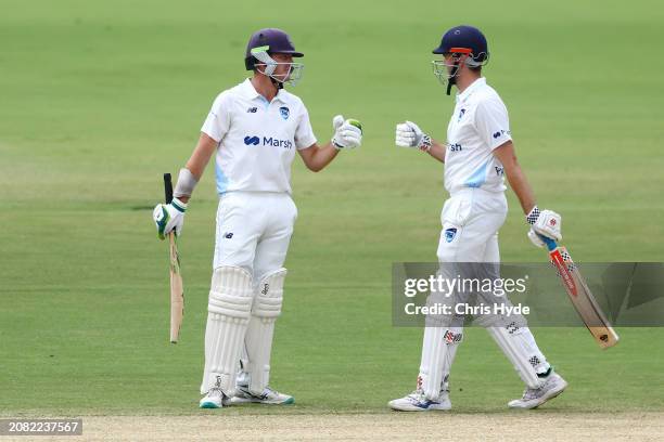 Daniel Hughes and Kurtis Patterson of New South Wales during the Sheffield Shield match between Queensland and New South Wales at Allan Border Field,...