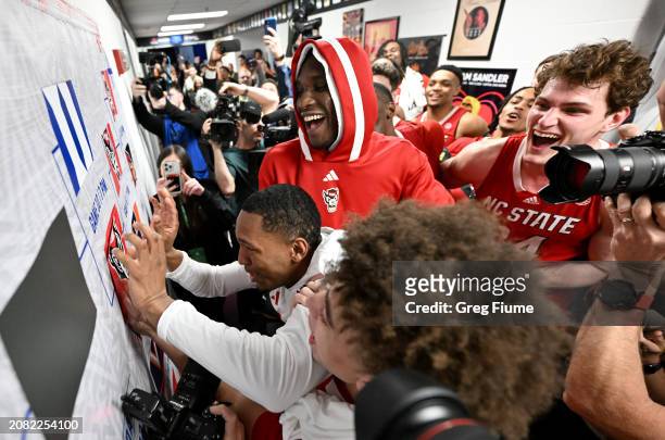 Keatts of the North Carolina State Wolfpack advances the sticker on the bracket after a 83-65 victory against the Syracuse Orange in the Second Round...