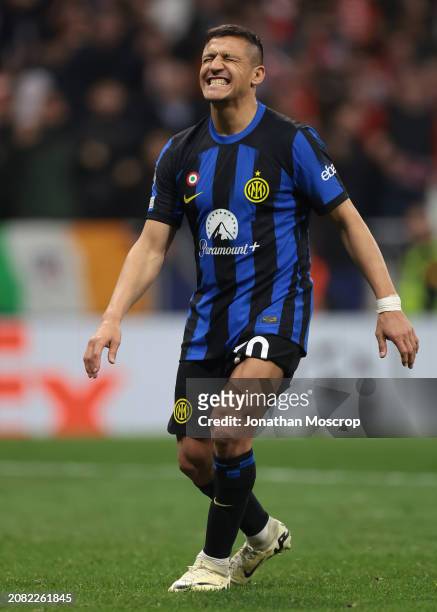Alexis Sanchez of FC Internazionale reacts after missing a penalty in the shoot out of the UEFA Champions League 2023/24 round of 16 second leg match...