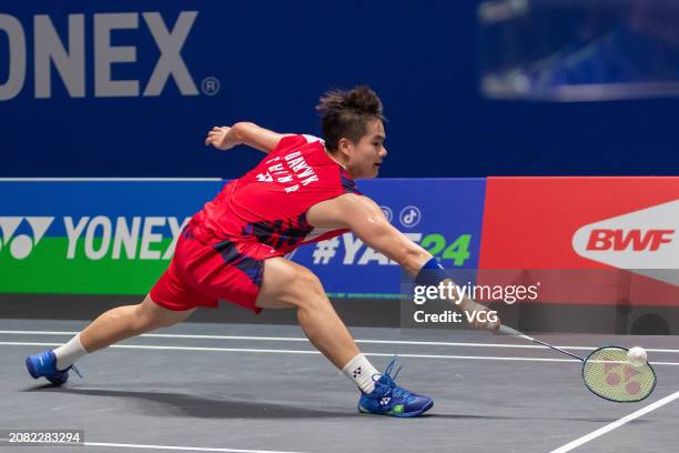 Liang Weikeng of China competes in the Men's Doubles Round of 32 match against Adam Dong Xingyu and Nyl Yakura of Canada during day two of the Yonex...