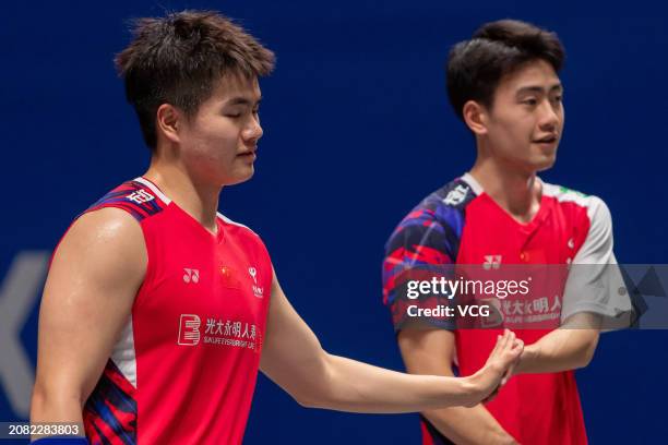 Liang Weikeng and Wang Chang of China compete in the Men's Doubles Round of 32 match against Adam Dong Xingyu and Nyl Yakura of Canada during day two...