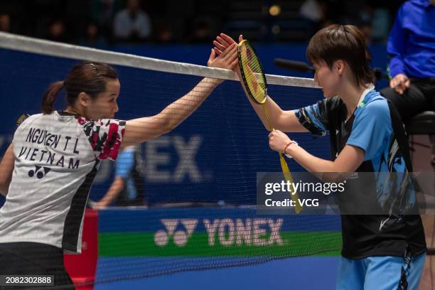 Chen Yufei of China shakes hands with Nguyen Thuy Linh of Vietnam in the Women's Singles Round of 32 match during day two of the Yonex All England...
