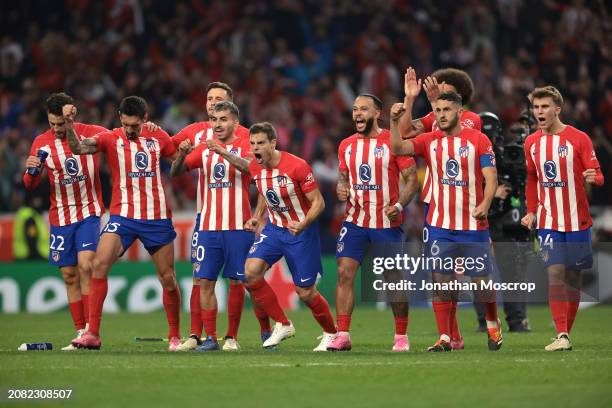 Atletico Madrid players react during the penalty shoot out of the UEFA Champions League 2023/24 round of 16 second leg match between Atlético Madrid...