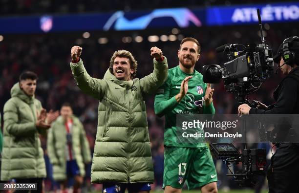 Antoine Griezmann of Atletico Madrid celebrates with Jan Oblak following the team's victory in the penalty shoot out during the UEFA Champions League...