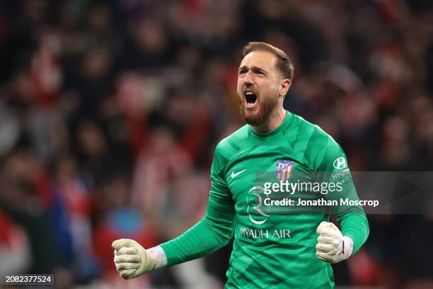 Jan Oblak of Atletico Madrid celebrates after teammate Memphis Depay scored a late goal to take the tie to extra time during the UEFA Champions...