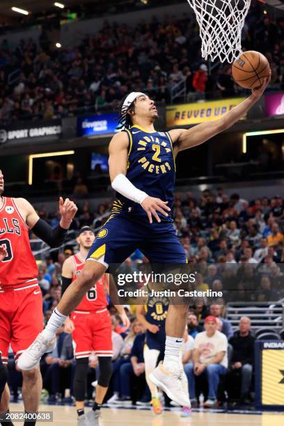 Andrew Nembhard of the Indiana Pacers takes a shot during the first half in the game against the Chicago Bulls at Gainbridge Fieldhouse on March 13,...