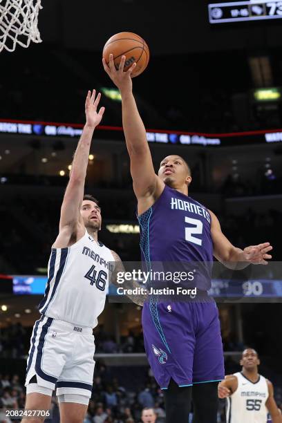 Grant Williams of the Charlotte Hornets goes to the basket against John Konchar of the Memphis Grizzlies during the second half at FedExForum on...