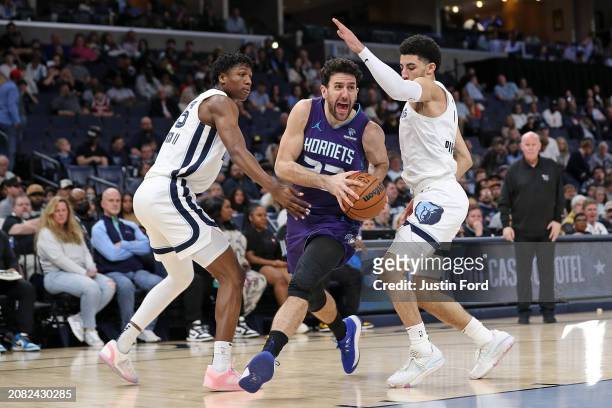 Vasilije Micic of the Charlotte Hornets drives to the basket during the second half against Scotty Pippen Jr. #1 of the Memphis Grizzlies and GG...