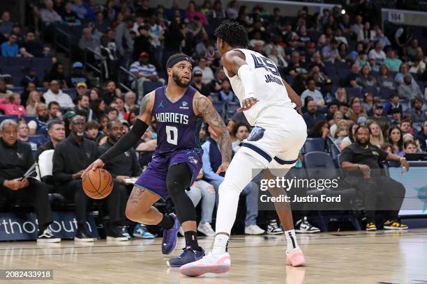 Miles Bridges of the Charlotte Hornets handles the ball against GG Jackson of the Memphis Grizzlies during the second half at FedExForum on March 13,...