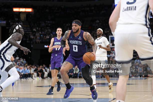 Miles Bridges of the Charlotte Hornets handles the ball during the second half against the Memphis Grizzlies at FedExForum on March 13, 2024 in...