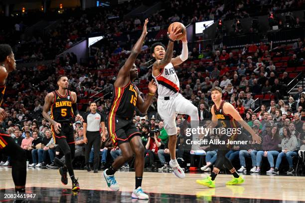 Anfernee Simons of the Portland Trail Blazers drives to the basket against Clint Capela of the Atlanta Hawks during the second quarter of the game at...