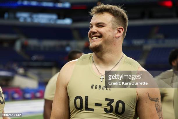 Garret Greenfield #OL30 of South Dakota State laughs during the NFL Scouting Combine at Lucas Oil Stadium on March 3, 2024 in Indianapolis, Indiana.