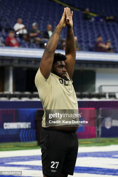 Delmar Glaze #OL27 of Maryland stretches during the NFL Scouting Combine at Lucas Oil Stadium on March 3, 2024 in Indianapolis, Indiana.