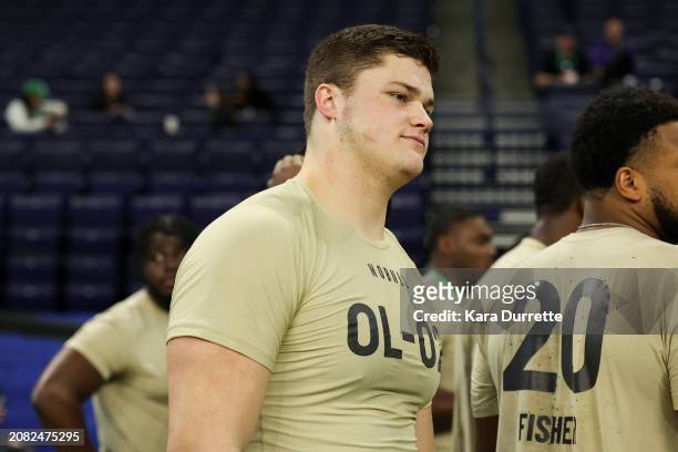 Joe Alt #OL02 of Notre Dame listens to instructions during the NFL Scouting Combine at Lucas Oil Stadium on March 3, 2024 in Indianapolis, Indiana.