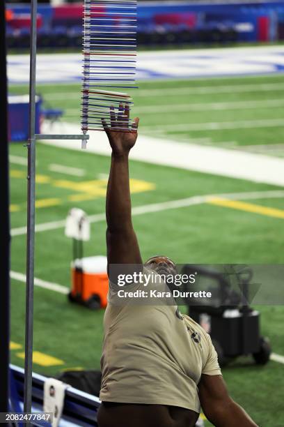 Jeremy Flax #OL21 of Kentucky participates in the vertical jump during the NFL Scouting Combine at Lucas Oil Stadium on March 3, 2024 in...