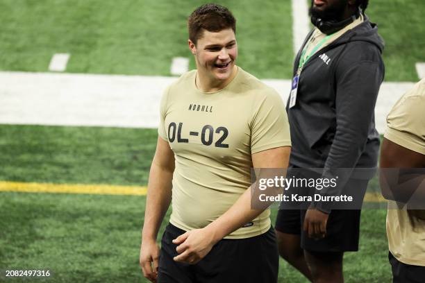 Joe Alt #OL02 of Notre Dame laughs during the NFL Scouting Combine at Lucas Oil Stadium on March 3, 2024 in Indianapolis, Indiana.