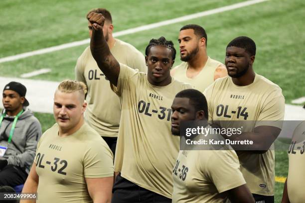 Tyler Guyton #OL31 of Oklahoma gestures during the NFL Scouting Combine at Lucas Oil Stadium on March 3, 2024 in Indianapolis, Indiana.