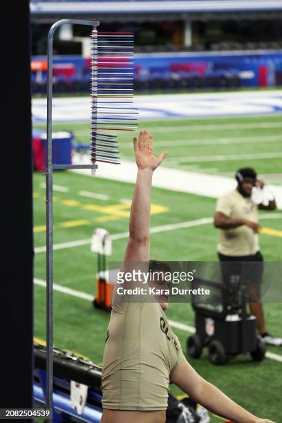 Joe Alt #OL02 of Notre Dame participates in the vertical jump during the NFL Scouting Combine at Lucas Oil Stadium on March 3, 2024 in Indianapolis,...