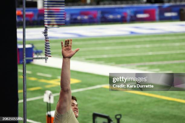 Joe Alt #OL02 of Notre Dame prepares for the vertical jump during the NFL Scouting Combine at Lucas Oil Stadium on March 3, 2024 in Indianapolis,...