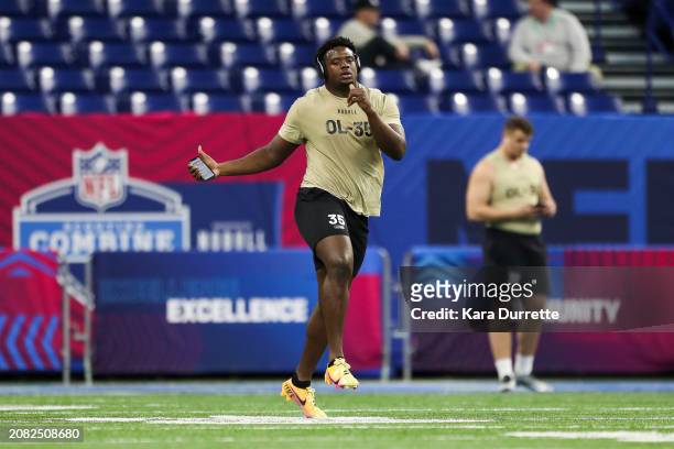 Christian Jones #OL35 of Texas warms up during the NFL Scouting Combine at Lucas Oil Stadium on March 3, 2024 in Indianapolis, Indiana.
