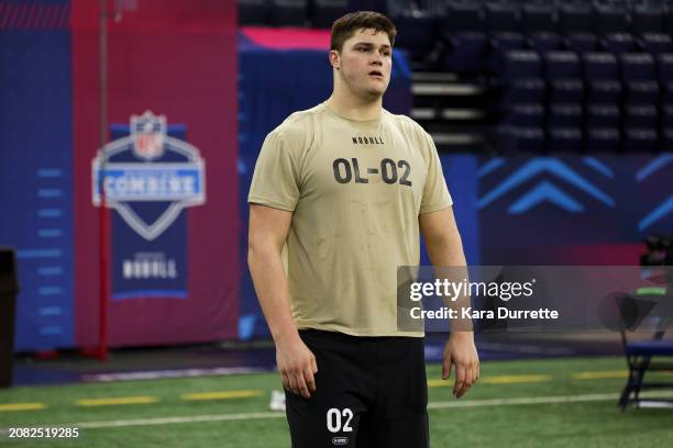 Joe Alt #OL02 of Notre Dame stands on the sideline during the NFL Scouting Combine at Lucas Oil Stadium on March 3, 2024 in Indianapolis, Indiana.