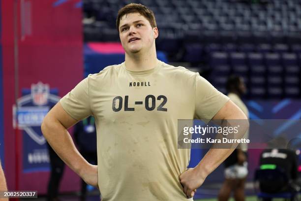 Joe Alt #OL02 of Notre Dame watches a drill during the NFL Scouting Combine at Lucas Oil Stadium on March 3, 2024 in Indianapolis, Indiana.