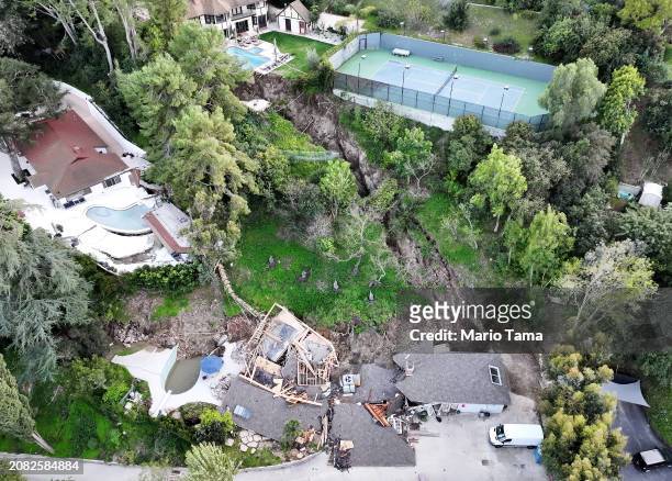 An aerial view shows a landslide which destroyed one home and damaged two others in the Sherman Oaks neighborhood on March 13, 2024 in Los Angeles,...