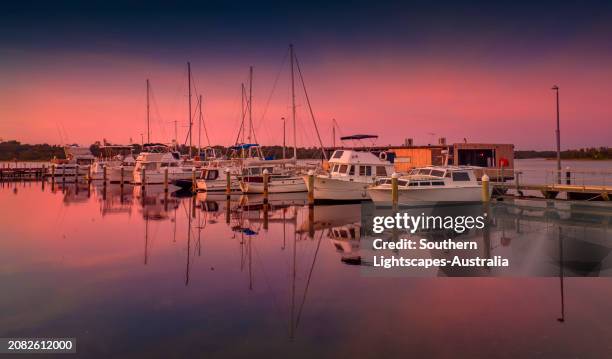 dawn light on a late summer's morning  at the lakes entrance harbour, victoria, australia. - australia jetty stock pictures, royalty-free photos & images